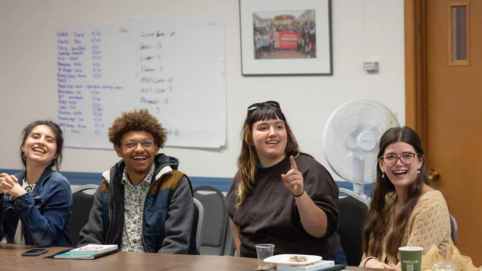 A group shares a light moment during an organizing workshop.